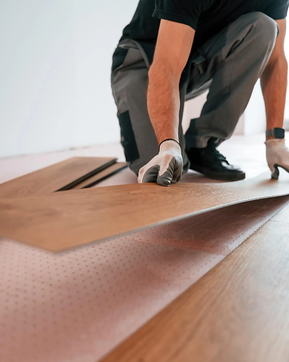 Commercial vinyl plank flooring being installed